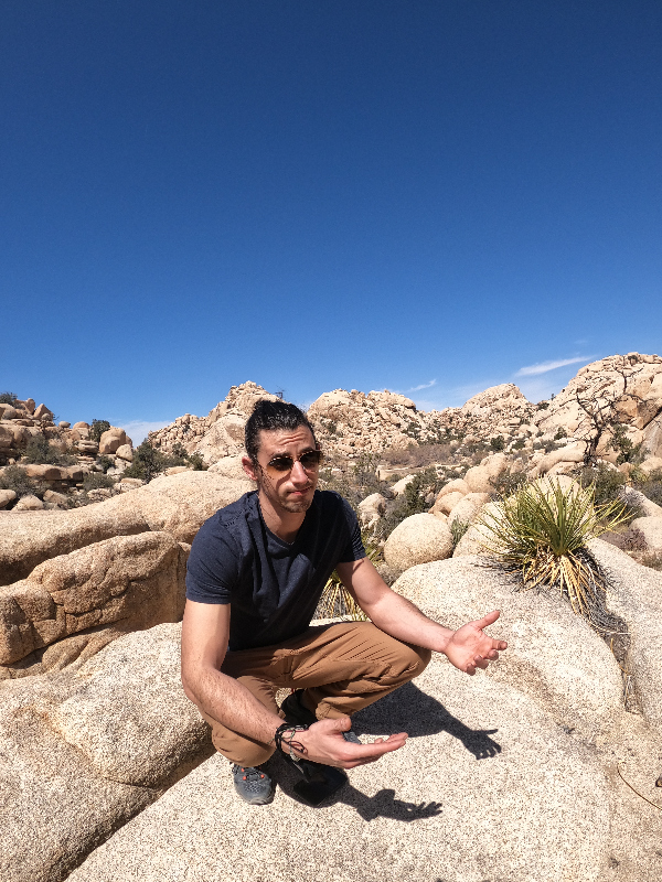 Man crouching in Joshua Tree National Park